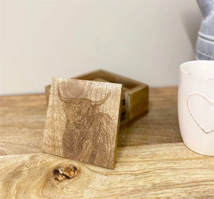 Ensemble en bois de 4 sous-verres de vache gravés